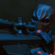 Slade Wilson preparing to murder an unsuspecting target.